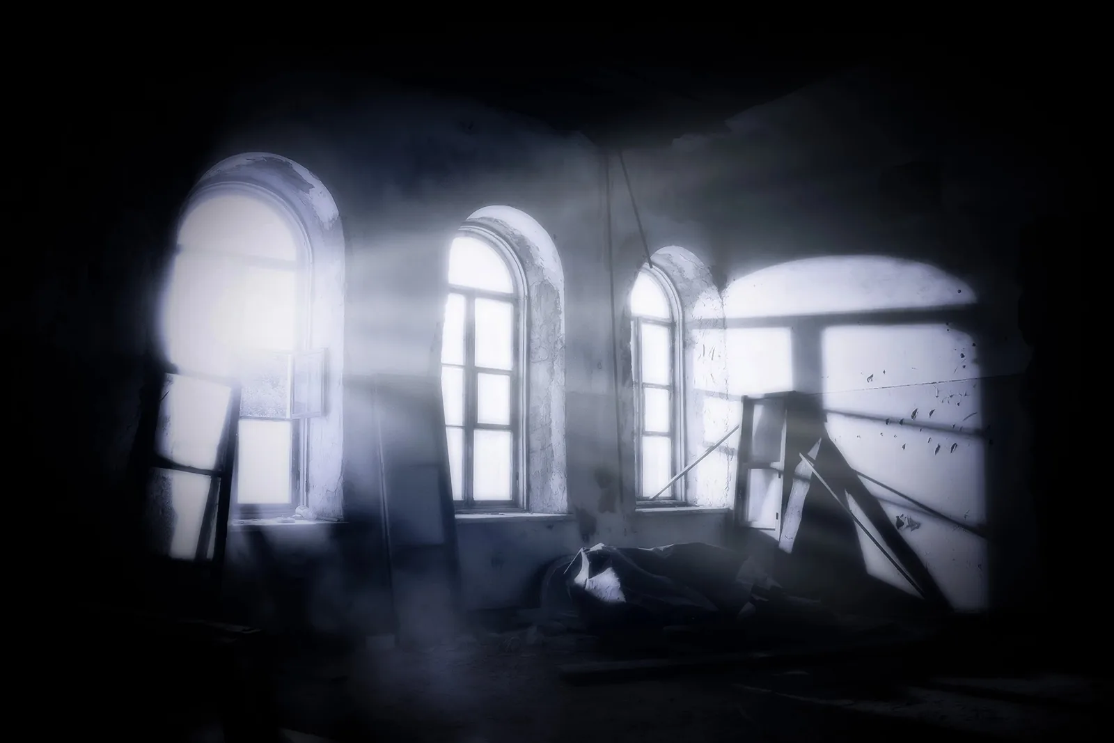 Moonlight pouring through the broken arched windows of an abandoned room, from The Possession artwork